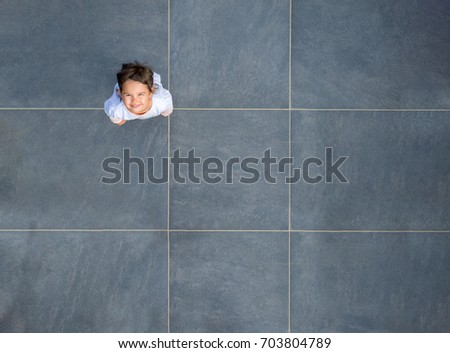 Top view of little girl smiling Royalty-Free Stock Photo #703804789