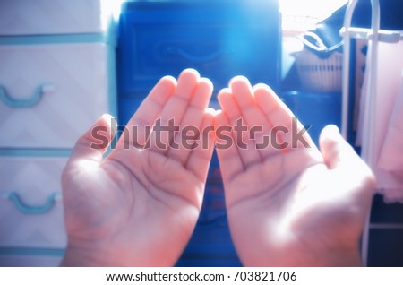 hands praying from god, blured picture, selective focus, silhouette