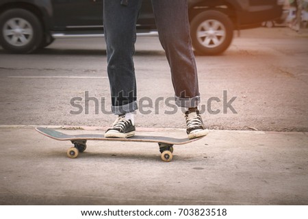 Asian Teen Girl With Skateboard style in outdoors skate park street with dark vintage tone style