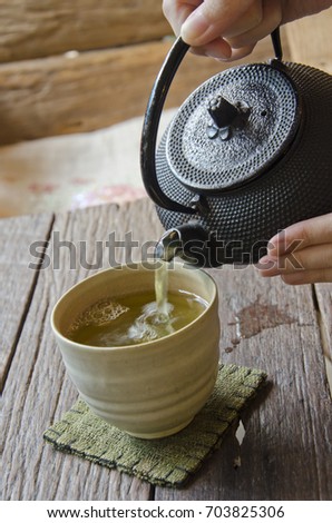 Pouring Japanese green tea