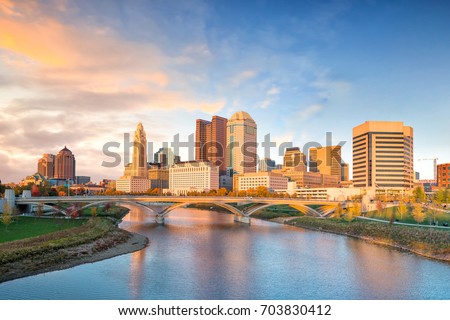 View of downtown Columbus Ohio Skyline at Sunset  Royalty-Free Stock Photo #703830412