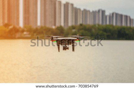 Flying drone with high resolution digital camera on the sky