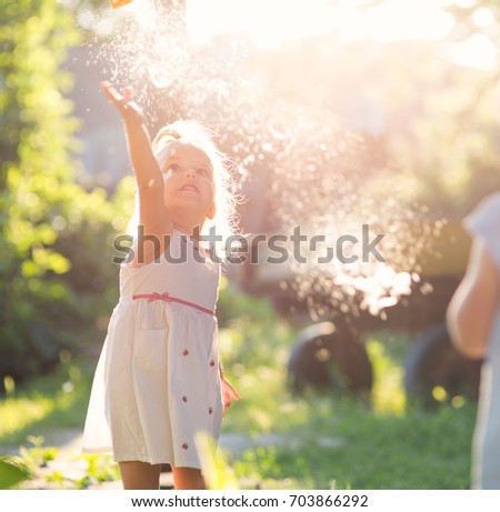 Children play with soap bubbles outdoors