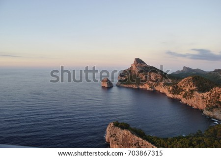 Beautiful, colorful sunset. Beautiful view of the sea and mountains. Evening landscape. Majorca. Balearic Islands. Spain. 