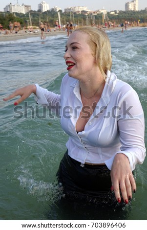 business woman have fun on a sea beach