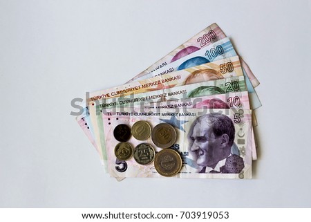 Whole set of Turkish Lira banknotes and coins on white background with copy space