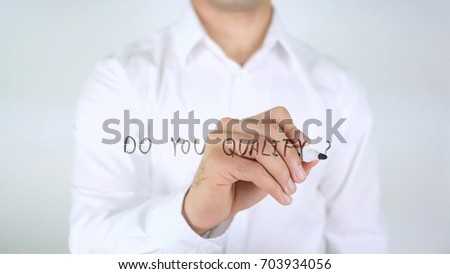 Do You Qualify, Man Writing on Glass Royalty-Free Stock Photo #703934056