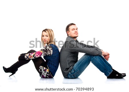 Portrait of a beautiful young happy  couple isolated on white
