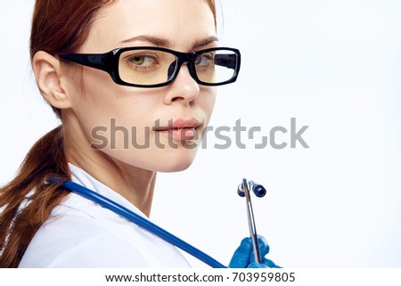 Beautiful female doctor with glasses, portrait, close-up.