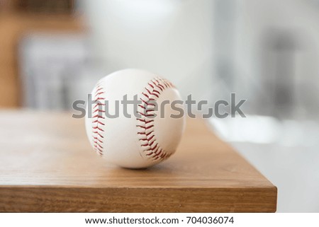 baseball on wooden seat closeup