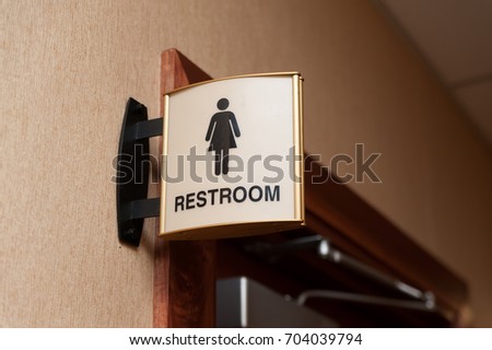 Women restroom sign close up