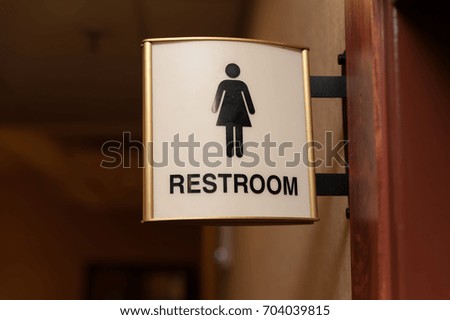 Women restroom sign close up