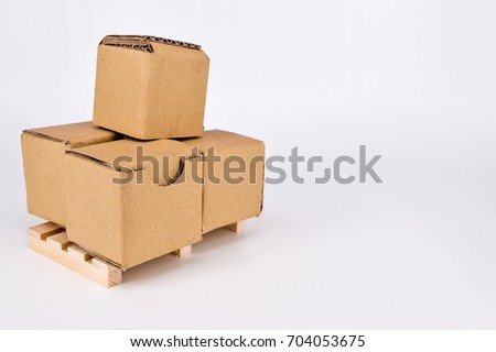  Cardboard boxes and wooden pallet on white background. Warehouse, shipping, cargo and delivery concept.