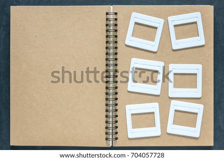 Plastic film slides on book 