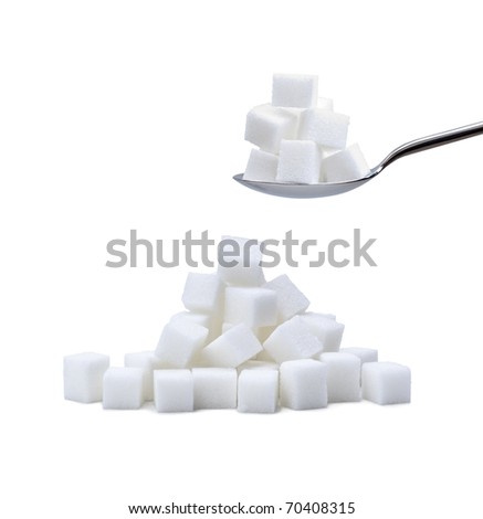 random pile of refined white sugar cubes with a second pile on a steel spoon on white background Royalty-Free Stock Photo #70408315