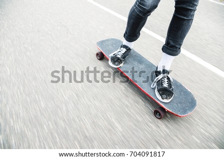 Close up of a longboarders feet while skating