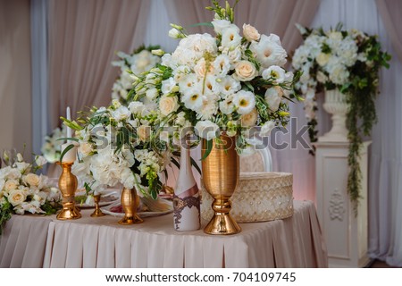 Beautiful decorated wedding restaurant for marriage. Colorful decoration for celebration. Beauty bridal interior. Concept of style of banquet hall
