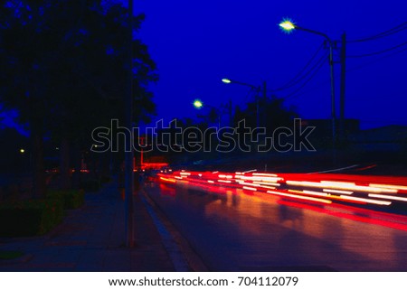 car lights at night in city and headlights. Long exposure with copy space add text
