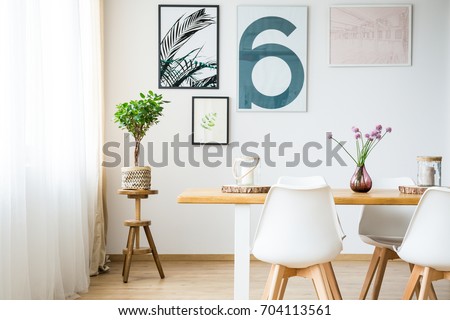 Modern bright dining room with chairs and table
