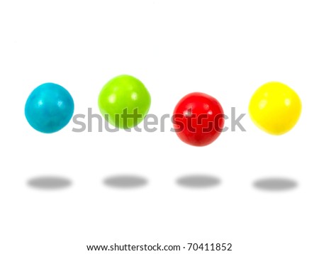 Large colored gumballs set against a white background Royalty-Free Stock Photo #70411852