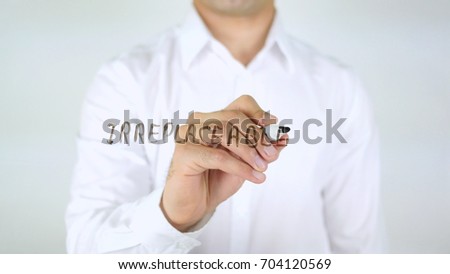 Irreplaceable, Man Writing on Glass Royalty-Free Stock Photo #704120569