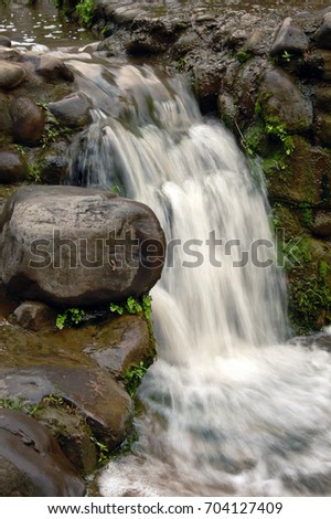 Artificial waterfall in Rock Garden, Chandigarh, India shot at slow shutter speed to show full force of water
