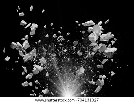 split debris caused by explosion against black background Royalty-Free Stock Photo #704131027
