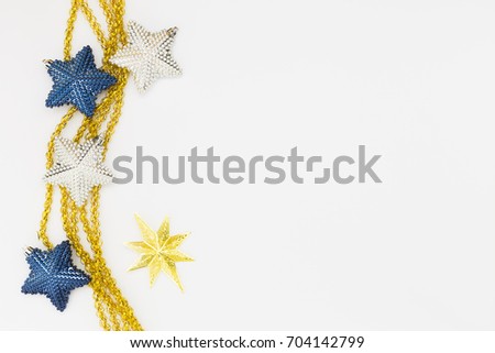 Beautiful white, gold and blue christmas decoration with golden ribbons on white background