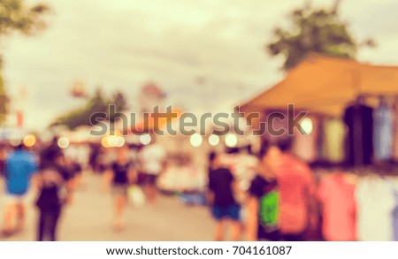 Abstract blur image of Day market on street with bokeh for background usage . (vintage tone)