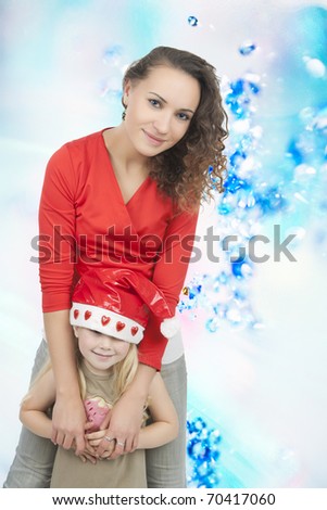 young caucasian happy looking mother and daughter standing together having warm facial expression