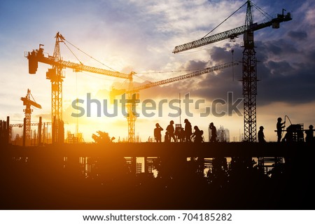 Construction worker working on a construction site Royalty-Free Stock Photo #704185282
