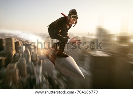Man on a rocket above new york city Royalty-Free Stock Photo #704186779