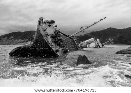 Wrecked ship along the rocky coast (Black and white)