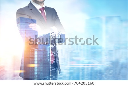 Close up of an unrecognizable young businessman standing with crossed arms against a morning city panorama. Mock up toned image double exposure