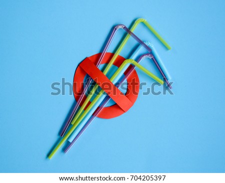 Stop symbol in red with plastic straws and fork. Plastic pollution is harmful to  marine lives and hurting turtles , whales and sharks. Environmental concept. Ban single use plastic campaign.