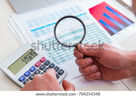 Finance analyst looking and financial reports