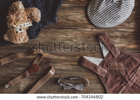 Flat lay photography of boy's casual outfits, Outfits of traveler, boy, male, Men's casual outfits on wood board background - Vintage effect style picture