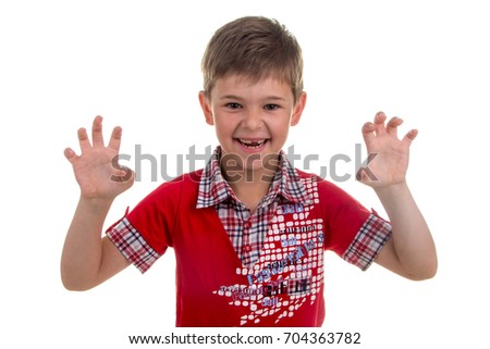 Portrait of emotionally kid, roaring like a lion on white background