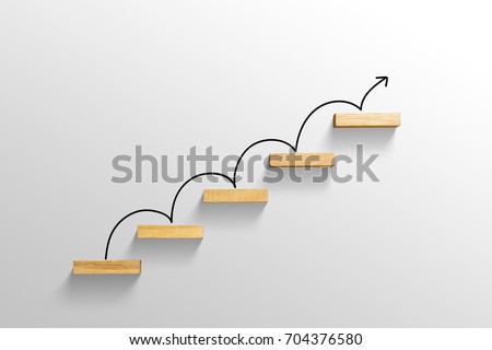 rising arrow on staircase, increasing business Royalty-Free Stock Photo #704376580