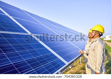 Two engineers are checking solar photovoltaic