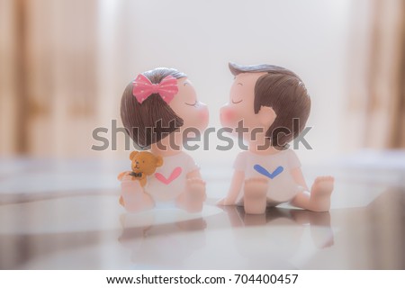 Romantic couple little boy and girl kissing for Valentine's day