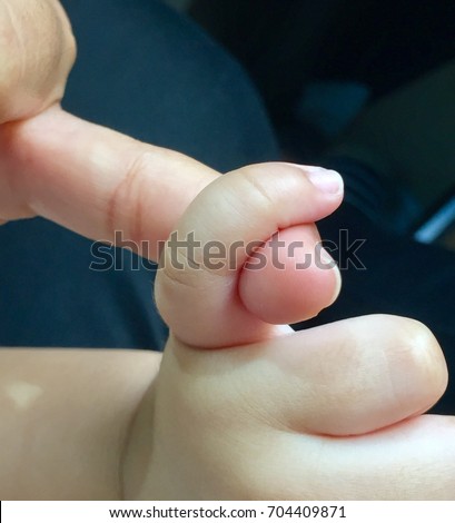 Background images. The little finger of a child about gallstones, tails you mother. Love the relationship of parent to child