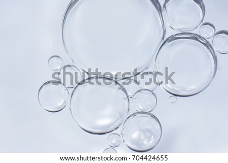 group of bubbles in white abstract background Royalty-Free Stock Photo #704424655