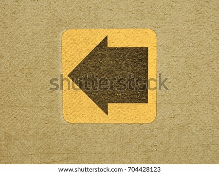 Black arrow on a yellow background.          