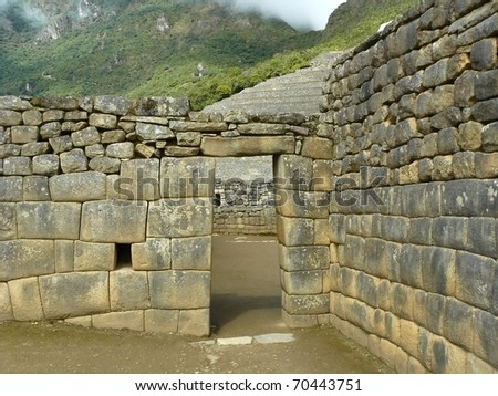 Machu Picchu, Peru. The ancient Inca city, located on the territory of  Peru at the top of a mountain ridge at an altitude of 2,450 metersl, dominating the valley of the Urubamba River.