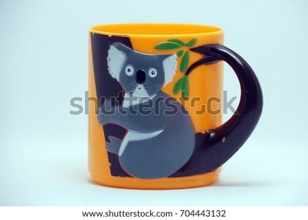 Orange cartoon design cup for kids on white background