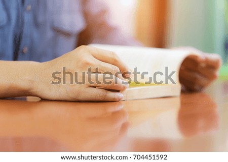 Businessman reading a book on the desk with copy space