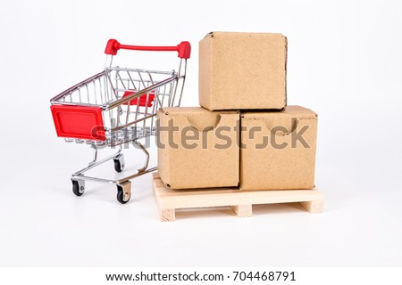  Cardboard boxes,shopping cart and wooden pallet on white background. Warehouse, shipping, cargo and delivery concept.