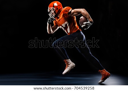 American football sportsman player runing on black background