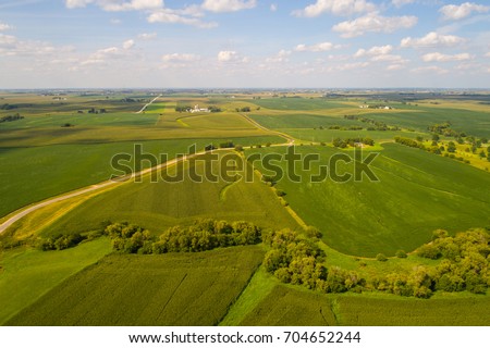 Aerial drone image of farmland landscape in Iowa USA Royalty-Free Stock Photo #704652244